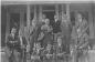 Western Union Staff on front steps of Staff House.