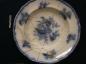Refined White Earthenware Plate, Decorated with a Floral Blue Design over a Molded Edge