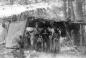 Group of Okanagans under a rack of drying fish