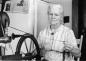 Josie (Josephine) Delaney Small at her spinning wheel, spinning wool