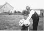 Judson Morehouse with his grandson, Sidney Jr. with a pet calf owned by Judson.