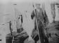 William Hartman shown with fish drying on a clothesline, an alternative to fish flakes.