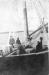 The freighter ' Tagati' iced up during a voyage. L to R: Grafton Outhouse, Frank Thurber
