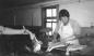 Ann Ameriault 'blacks' fish at D. B. Kenney Fisheries c. 1975 