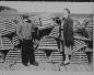Laurence Outhouse Sr. and his wife, Doris, standing in front of wooden lobster traps.