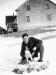 Clifton Outhouse poses with his dog and the rabbits caught that day.