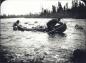 Wallace and Elson trekking their canoe through the rapids of Susan Brook.