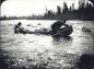 Wallace and Elson trekking their canoe through the rapids of Susan Brook.