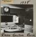 The radio control room of CKNX in 1938.