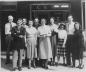 Early staff of CKNX radio standing outside the original station, Josephine Street, Wingham, Ontario.