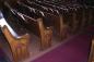 Notice the Gothic Arch design in the end of each pew.
