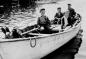 A fisherman and his grandchildren enjoy a ride in his punt.