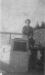 Fred Thompson sitting on boathouse