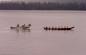 Haida canoe and boat in Masset Inlet.