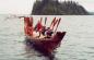 Chief Edensu is being escorted to shore at a Feast in Skidegate.