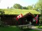 Laft Hus at Heritage Square in Red Deer, Alberta Canada - with Canada and Norway flags