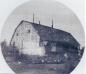 Side view of Log cabin 1890 with Edwy, Cecil, and Harry Vane in front