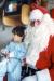 Cst R. Lefebvre dressed as Santa Claus, visiting children in the hospital.