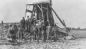 A group of miners beside the first mine shaft