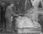 A young miner breaking up rocks of salt