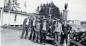 Men gathered by the gas pumps at Willie O's store