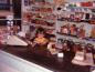 Mildred and Garth Hosking's grandchild behind the counter shortly before the store closed