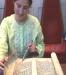 A Member of Temple's Youth Group (MOFTY) Reads from the Megillat Esther