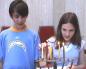 Members of the Temple's Youth Group (MOFTY) Light the Chanukah Candles