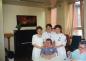 Nursing staff and hospital resident posing for a photograph