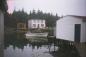 House, stage and boat at South East Bight