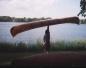 Dave lifting a birch bark canoe