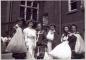 Girls pose in uniform styles from the early 20th century