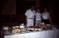 Staff displaying food table at main lodge at Harbour Island