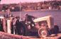 Loading a new tractor onto barge at Kagawong for delivery to Harbour Island