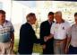 Joseph Kruger shaking hands with retiree Cort Elkins at Monument Dedication.