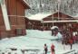 A large line of skiers wait their turn to take Whistler's Creekside Gondola. 