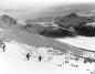 People skiing down the slopes of Seventh Heaven on Blackcomb Mountain. 