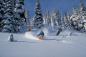 Winter enthusiasts enjoy a sunny day with new snow on the mountain.  Photograph by Greg Eymundson.