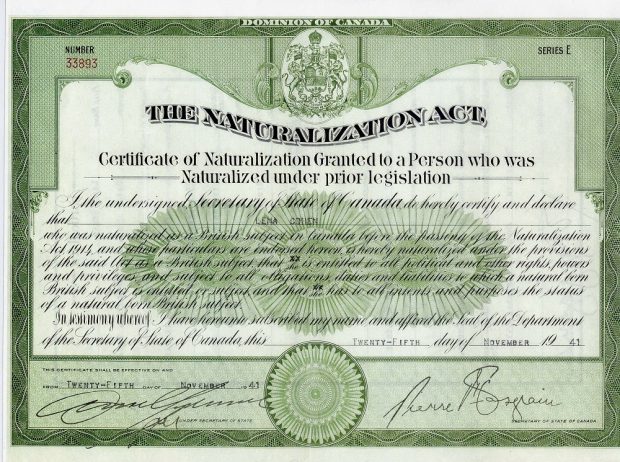 Printed document with green border and text granting naturalization to immigrants under The Naturalization Act of Canada