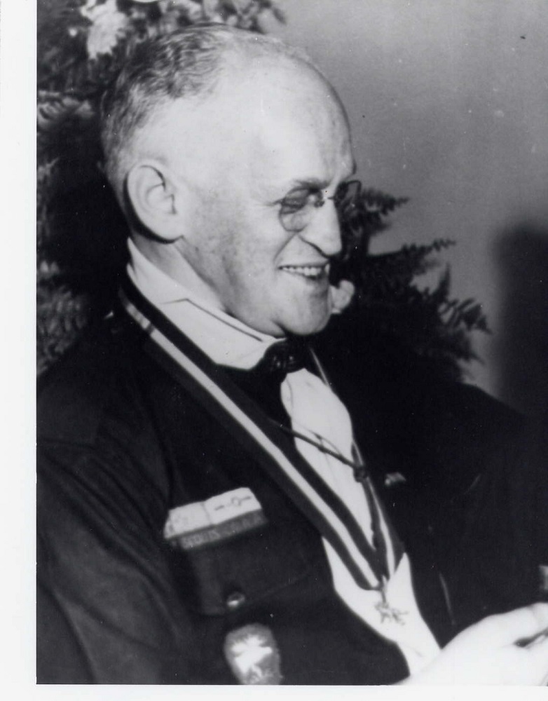 Portrait in profile of man wearing Scout Leader uniform