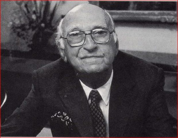 Portrait of bald man in business suit with glasses