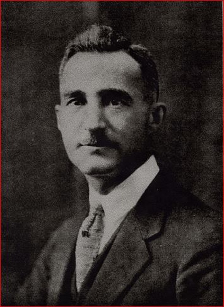 Formal portrait of man in business suit with mustache