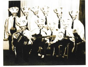 Black and white photograph showing a group of musicians wearing costumes for Laetare Sunday..
