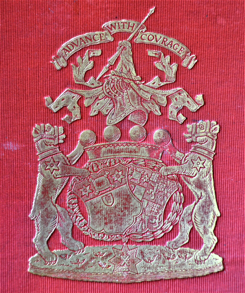 Silver family crest on a red background of two lions flanking shields with the motto "Advance With Courage" above.