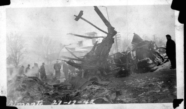 The wrecked Ottawa Valley Local train in Almonte in the aftermath of the train wreck with people standing around it, 1942