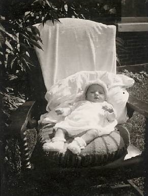 Photograph of infant Denyse Turcotte in a chair, 1942