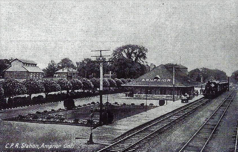 Black and white photographic postcard of the train station in Arnprior, 1950s