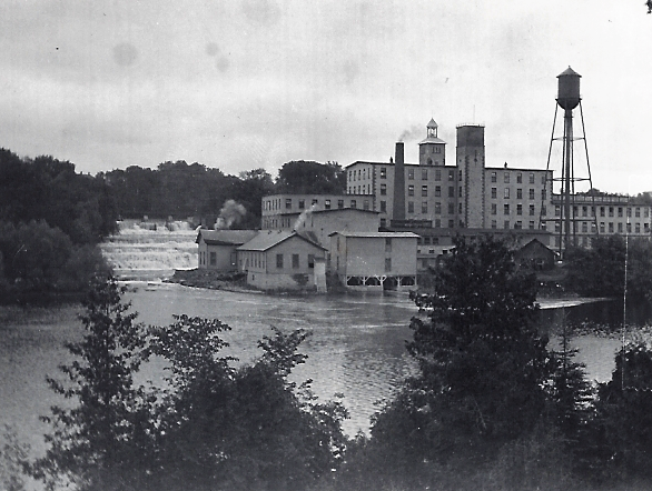 Black and white photograph of the Rosamond Woollen Mill factory complex in Almonte on the Mississippi River, 1950s