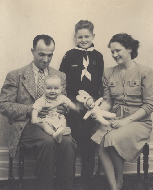 The four members of the Turcotte family sitting for a portrait, 1946