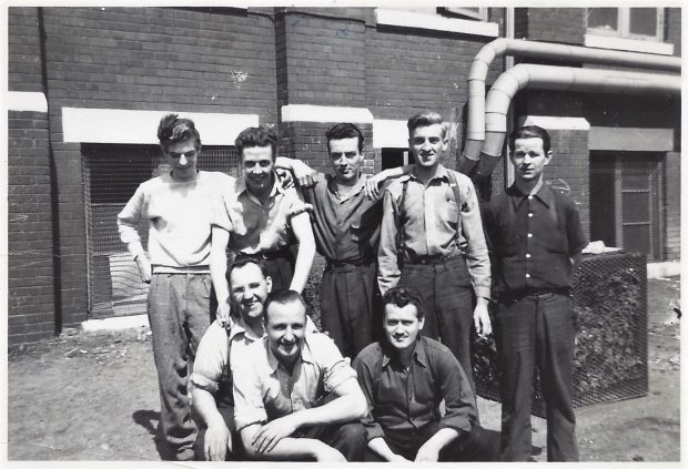 Period photograph of Mac Crozier and seven of his co-workers at De Havillands Ltd, 1942